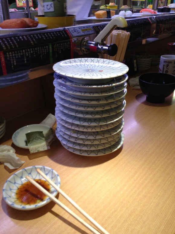stack of plates from conveyor belt sushi