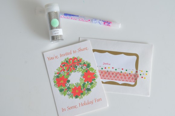 glue pen and glitter on invitation
