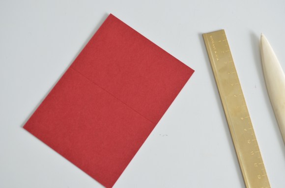 scored card stock with Midori brass ruler and bone folder