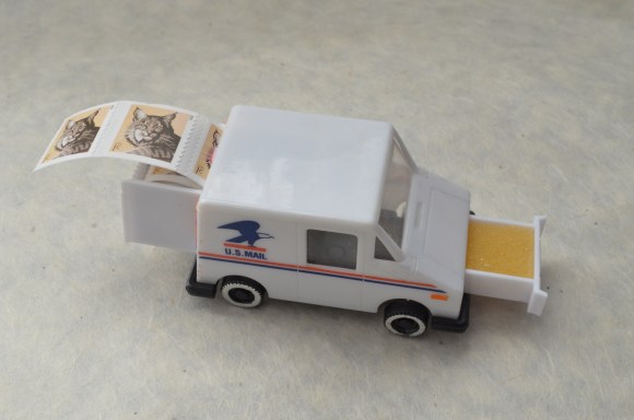 vintage postal truck stamp holder, open