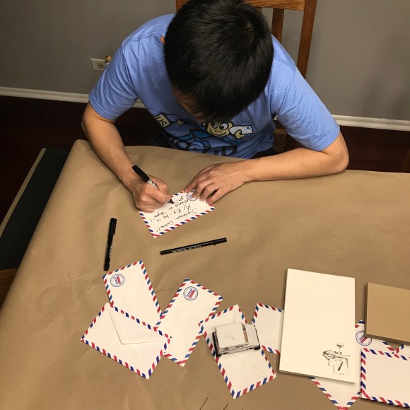 letter writing party decorations, letters & libations, paper decorations, mail decorations, kraft paper tablecloth, post office in many languages