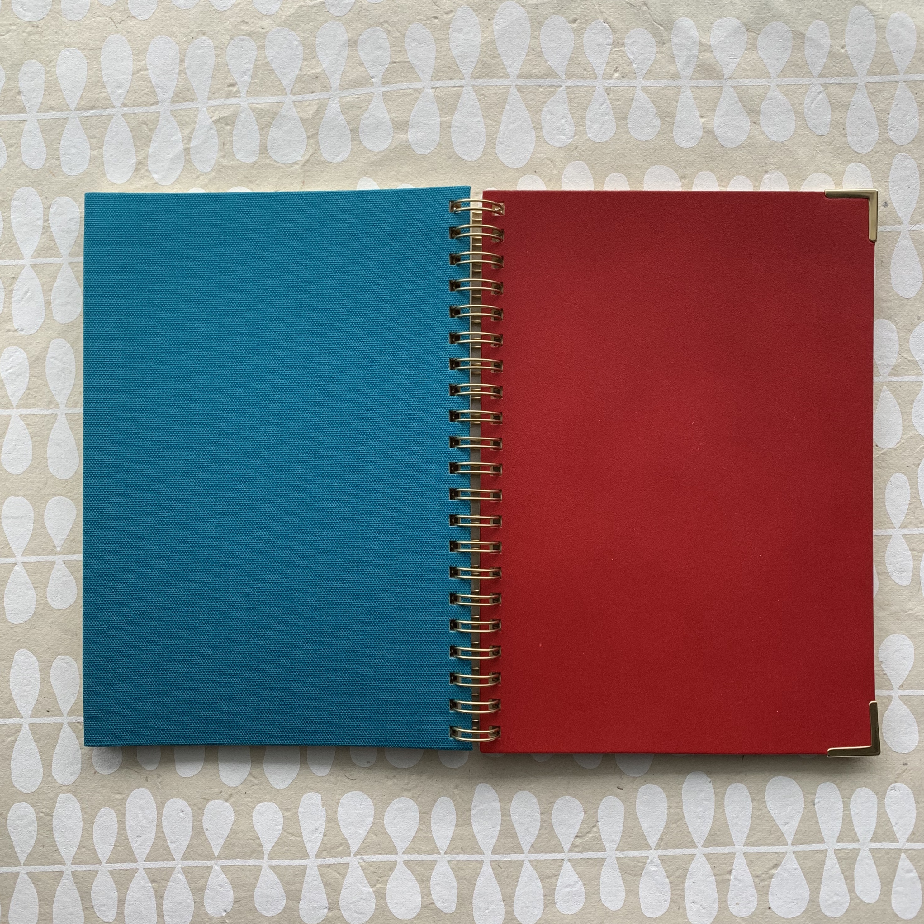 Kakimori notebook, red leather, gold accents, blue bookcloth